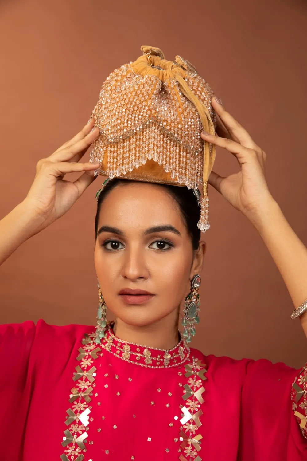 Elegant Golden Potli Bag With White Crystal Drops