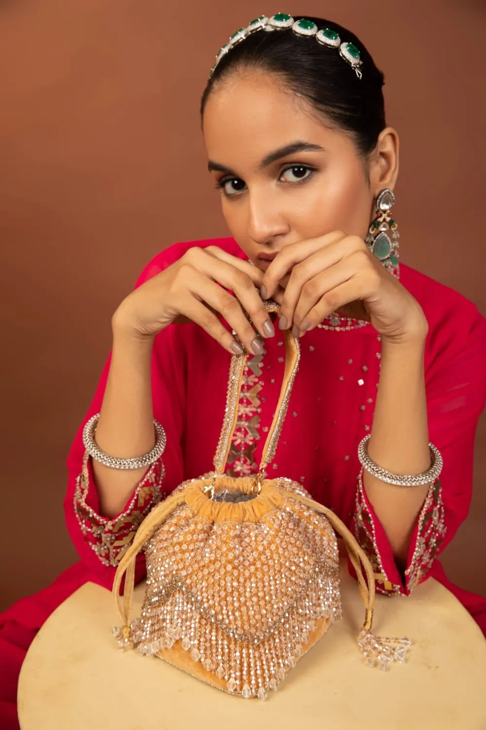 Elegant Golden Potli Bag With White Crystal Drops